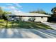 Charming single-story home with a well-maintained lawn and a classic design at 4128 Durant St, Port Charlotte, FL 33948