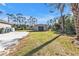 Large grassy backyard featuring a shed and plenty of room to enjoy the outdoors at 4175 Horseshoe Ave, North Port, FL 34286