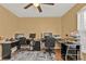 Well-lit home office with a ceiling fan, window, hardwood floors, and multiple desks and monitors at 4175 Horseshoe Ave, North Port, FL 34286