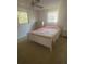Cozy bedroom features a queen-size bed and two bright windows at 432 Olivia Rd, Venice, FL 34293