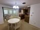 A bright dining area flows from the kitchen and overlooks the living room, creating an open and inviting space at 432 Olivia Rd, Venice, FL 34293