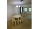 Charming dining area bathed in natural light, seamlessly blending into the adjacent living space at 432 Olivia Rd, Venice, FL 34293