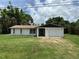 Charming single-story home with a one-car garage, surrounded by lush landscaping and a beautiful lawn at 432 Olivia Rd, Venice, FL 34293