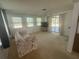 Bright and airy living room filled with natural light and sliding glass door access to the outdoors at 432 Olivia Rd, Venice, FL 34293