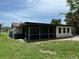 Enclosed sunroom features a screen, offering a cozy and versatile space at 432 Olivia Rd, Venice, FL 34293