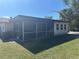 Enclosed sunroom features a screen, offering a cozy and versatile space at 432 Olivia Rd, Venice, FL 34293