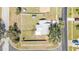 Aerial view of a single-Gathering home showcasing the full property, including the yard, landscaping, and surrounding neighborhood at 5909 Talbrook Rd, North Port, FL 34287