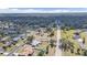 Scenic aerial view of a residential area, featuring tree-lined streets and single-Gathering homes, with mature trees and landscaping at 5909 Talbrook Rd, North Port, FL 34287