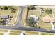 Aerial view of a single-Gathering home showcasing the full property, including the yard, landscaping, and surrounding neighborhood at 5909 Talbrook Rd, North Port, FL 34287
