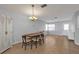 Inviting dining room featuring a chandelier, neutral walls, and tile flooring at 5909 Talbrook Rd, North Port, FL 34287