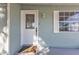 Inviting front door with glass detail, classic hardware, and a welcoming doormat at 5909 Talbrook Rd, North Port, FL 34287
