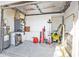A well-lit garage interior with storage and tools organized along the walls at 5909 Talbrook Rd, North Port, FL 34287