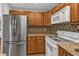 Well-equipped kitchen with granite countertops, stainless steel appliances, and ample cabinet space at 5909 Talbrook Rd, North Port, FL 34287
