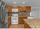 Well-equipped kitchen with granite countertops, stainless steel appliances, and ample cabinet space at 5909 Talbrook Rd, North Port, FL 34287
