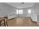Open living area with tile floors, soft gray walls, and modern white cabinets at 5909 Talbrook Rd, North Port, FL 34287
