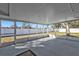 Screened-in patio providing a relaxing outdoor living space, offering views of the yard at 5909 Talbrook Rd, North Port, FL 34287