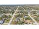 This is an aerial view of the neighborhood, with trees surrounding the community at 11338 Willmington Blvd, Port Charlotte, FL 33981