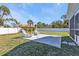 Well-maintained backyard with a concrete patio area and lounge chairs at 11338 Willmington Blvd, Port Charlotte, FL 33981