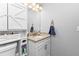 Clean bathroom with granite counter, modern sink, and white cabinets at 11338 Willmington Blvd, Port Charlotte, FL 33981
