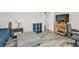 Bedroom featuring a comfortable ottoman and wood-look tile flooring at 11338 Willmington Blvd, Port Charlotte, FL 33981