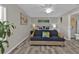 Bright bedroom with couch, accent lighting, and coastal-themed artwork at 11338 Willmington Blvd, Port Charlotte, FL 33981