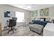 Cozy bedroom with a workspace, daybed, and natural light from the window at 11338 Willmington Blvd, Port Charlotte, FL 33981