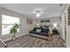 Serene bedroom with a comfortable couch, ceiling fan, and neutral decor at 11338 Willmington Blvd, Port Charlotte, FL 33981