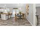 Cozy dining area featuring a round table, elegant chairs, and modern lighting fixture at 11338 Willmington Blvd, Port Charlotte, FL 33981