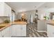 Kitchen and dining area with granite counters, wood floors, and stainless steel appliances at 11338 Willmington Blvd, Port Charlotte, FL 33981