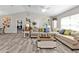 Spacious living room featuring modern flooring, neutral walls, stylish furniture, and lots of natural light at 11338 Willmington Blvd, Port Charlotte, FL 33981