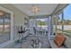 Comfortable porch with table, chairs, and backyard view at 11338 Willmington Blvd, Port Charlotte, FL 33981