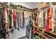 Organized walk-in closet with ample shelving and hanging space for clothes and accessories at 11338 Willmington Blvd, Port Charlotte, FL 33981