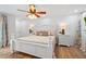 Well-lit bedroom with stylish lamps on the bedside tables and light colored wood flooring at 1316 Monte Carlo Ct, Punta Gorda, FL 33950