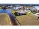 Amazing aerial view of the house situated on a waterfront property with beautiful landscaping at 17122 Barcrest Ln, Punta Gorda, FL 33955