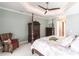 Relaxing bedroom features a four-poster bed, tray ceiling, and soothing color palette at 17122 Barcrest Ln, Punta Gorda, FL 33955