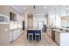 Gourmet kitchen features stainless steel appliances, granite counters, a wine cooler, and tile flooring at 17122 Barcrest Ln, Punta Gorda, FL 33955