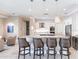 Well-appointed kitchen with granite countertops, stainless steel appliances, and breakfast bar seating for four at 17122 Barcrest Ln, Punta Gorda, FL 33955