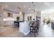 Spacious kitchen features stainless steel appliances, granite counters, and a large island with bar seating at 17122 Barcrest Ln, Punta Gorda, FL 33955