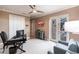 Well-lit home office with desk, seating, and french doors leading to the outdoor patio and pool area at 17122 Barcrest Ln, Punta Gorda, FL 33955