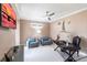 Comfortable home office featuring a large desk, two chairs, and a modern design at 17122 Barcrest Ln, Punta Gorda, FL 33955