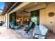 Comfortable outdoor living space with plush seating, a ceiling fan, and a view of the interior and backyard at 17122 Barcrest Ln, Punta Gorda, FL 33955