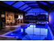 Inviting screened pool and patio area with outdoor kitchen, ample seating, and a relaxing spa at 17122 Barcrest Ln, Punta Gorda, FL 33955