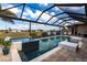 Beautiful pool with spa and lush landscaping at 17122 Barcrest Ln, Punta Gorda, FL 33955