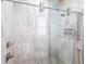 Modern shower with clear glass enclosure, neutral tiling, and dual shower heads at 17122 Barcrest Ln, Punta Gorda, FL 33955