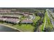 An aerial view of the community with a lake and lush landscaping at 20272 Lagente, Venice, FL 34293