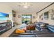Cozy living room features stylish furnishings, a ceiling fan, and a view of the outdoor scenery at 20272 Lagente, Venice, FL 34293