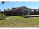 Backyard featuring a privacy fence and a tall tree at 21456 Holdern Ave, Port Charlotte, FL 33952