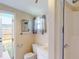 Bathroom featuring a sink, mirror, towel rack, toilet, and shower at 21456 Holdern Ave, Port Charlotte, FL 33952