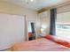 Bedroom featuring tile floors, closet and window with coverings at 21456 Holdern Ave, Port Charlotte, FL 33952