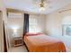 Bedroom with tile floors, ceiling fan and window with coverings at 21456 Holdern Ave, Port Charlotte, FL 33952